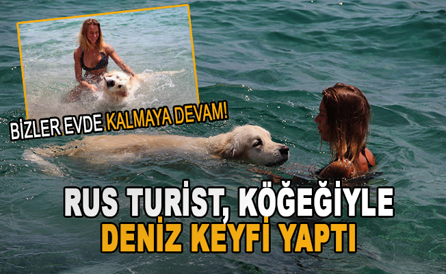 Rus turist, köpeğiyle deniz keyfi yaptı